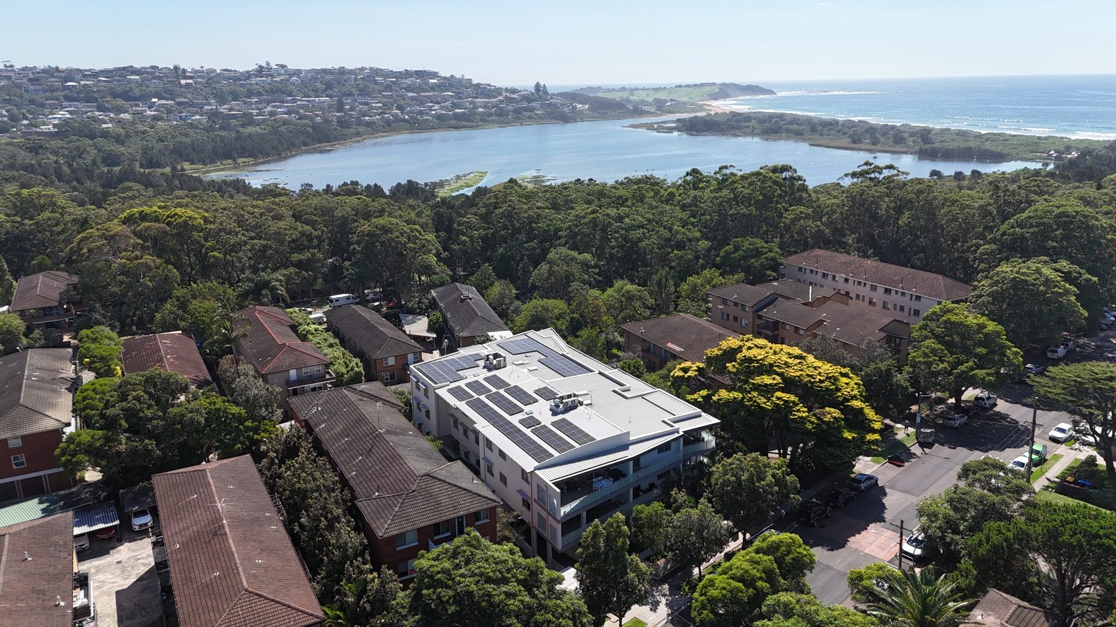 Aerial view of an Allume SolShare shared solar installation across an apartment block