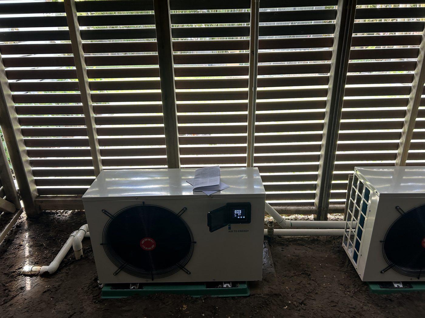Two iStore pool heat pump units installed side by side by Infinite Electrical & Solar