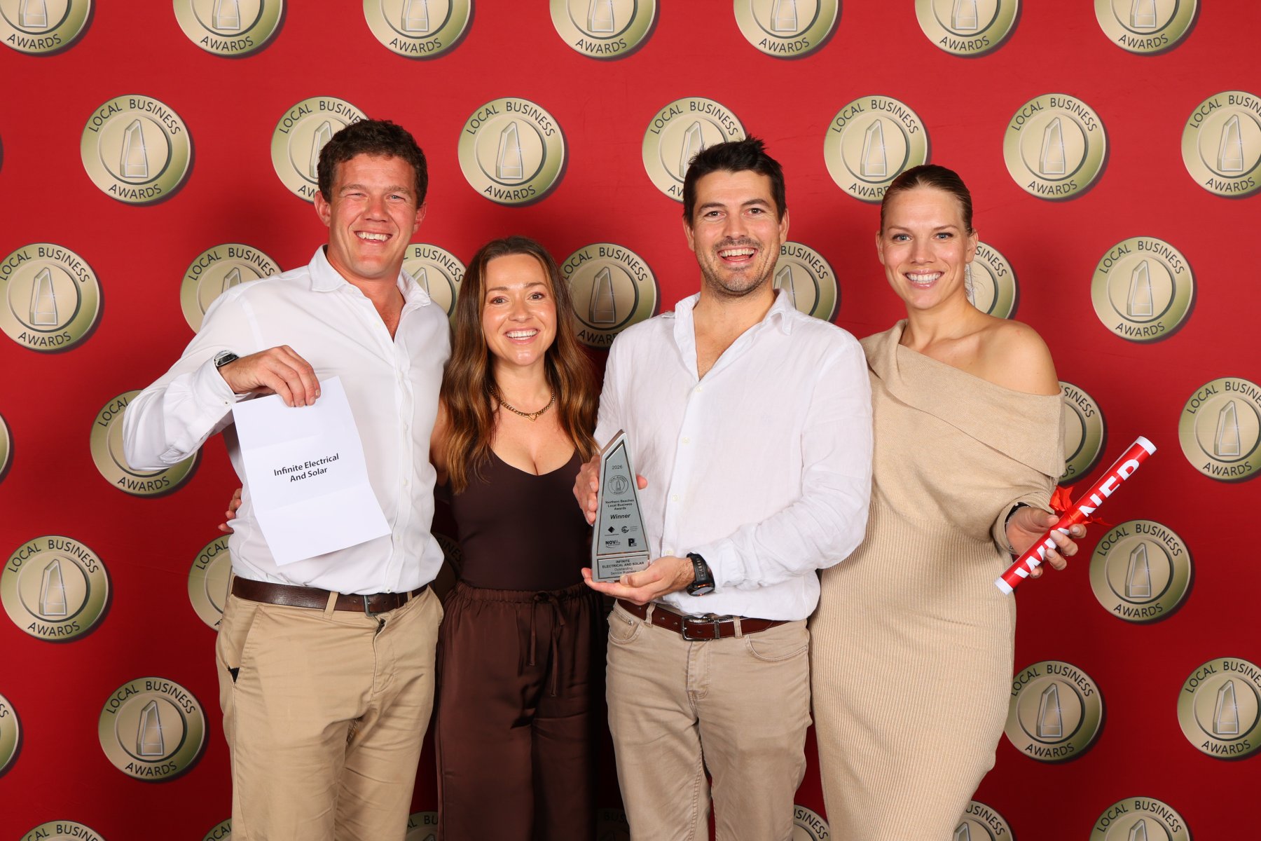 The Infinite Electrical & Solar team celebrating their 2026 Northern Beaches Local Business Award win